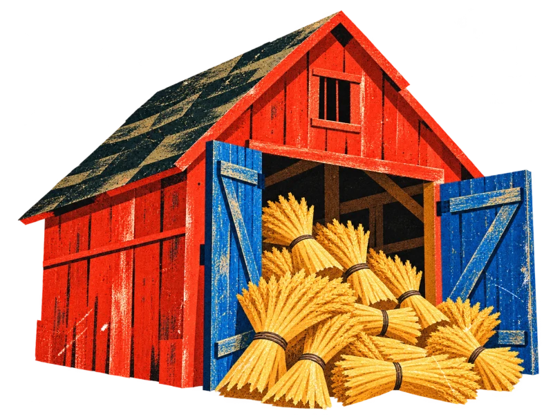 A red timber barn with open blue doors and golden grain bundles at its entrance.