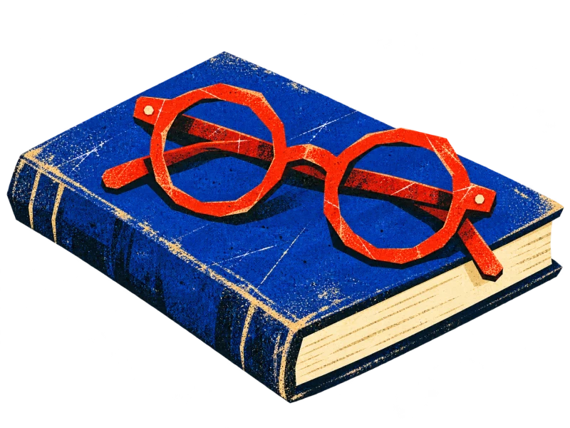 Red reading glasses with angular rims rest across a closed cobalt book with cream pages.