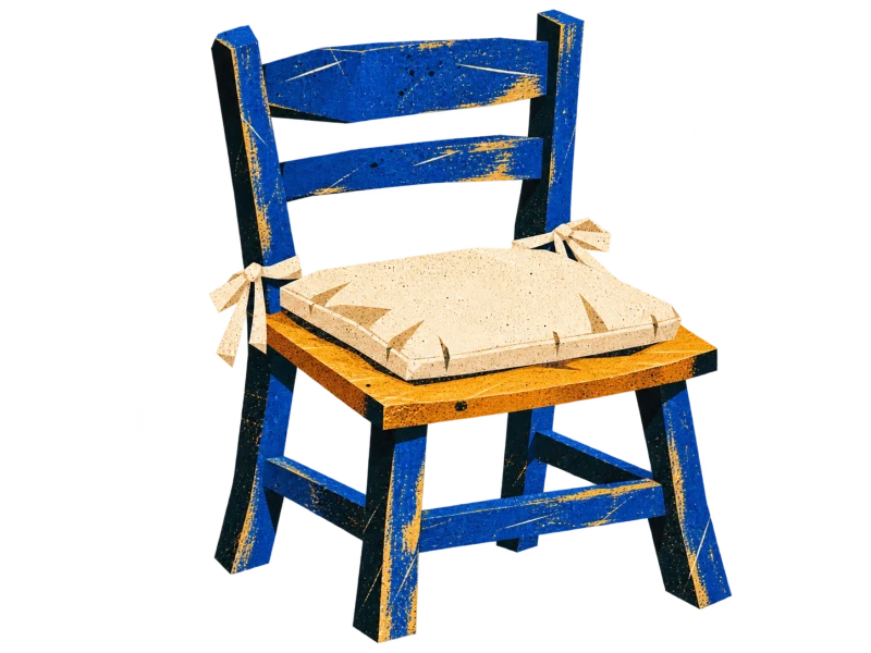 An empty cobalt wooden chair with a cream tied cushion on its ochre seat.